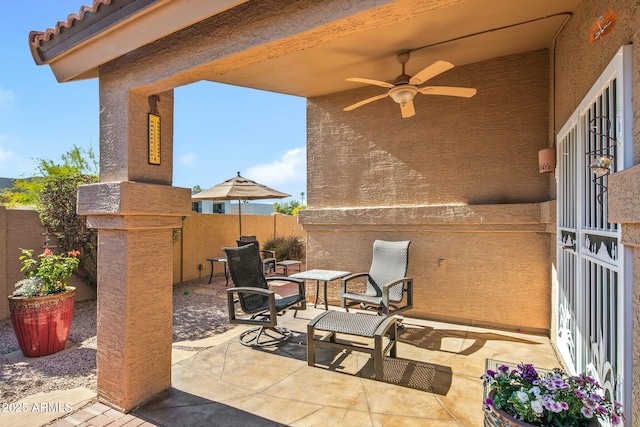 view of patio / terrace featuring ceiling fan