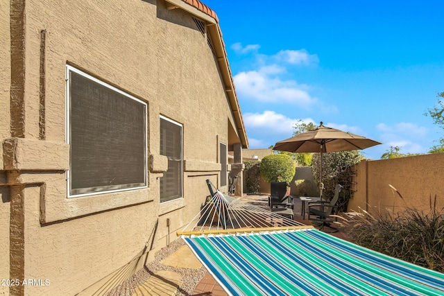 view of side of home featuring a patio