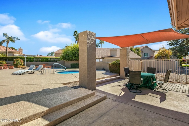 view of patio featuring a fenced in pool