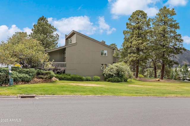 2665 N Valley View Rd Unit 10130, Flagstaff, AZ 86004 - view of home's exterior with a lawn and a chimney
