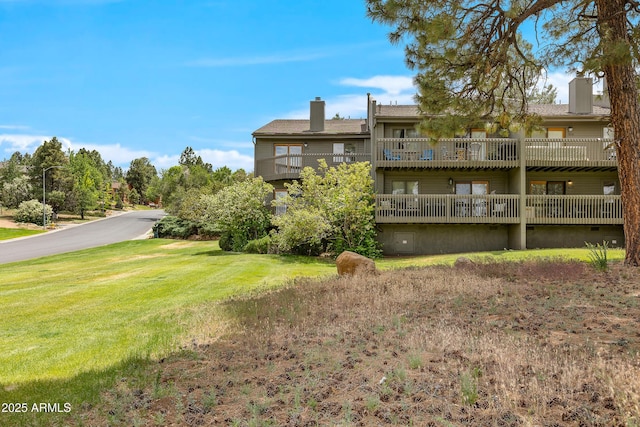 2665 N Valley View Rd Unit 10130, Flagstaff, AZ 86004 - rear view of property with a chimney and a yard