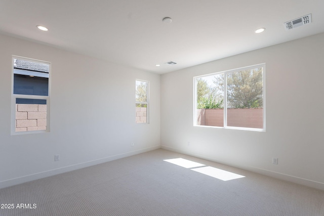11857 N Luckenbach St, Surprise, AZ 85388 - carpeted spare room featuring baseboards and recessed lighting