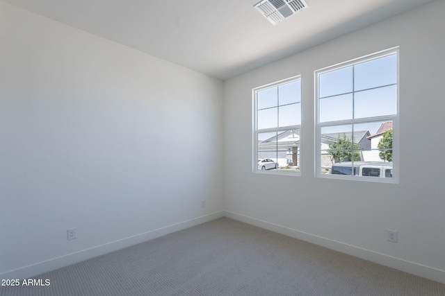 11857 N Luckenbach St, Surprise, AZ 85388 - unfurnished room featuring baseboards and light colored carpet