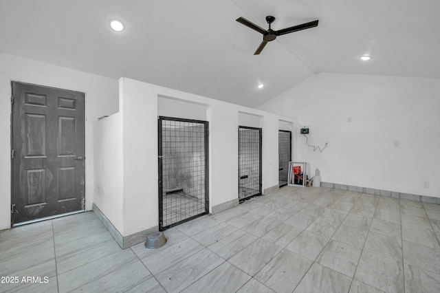 interior space featuring lofted ceiling and ceiling fan