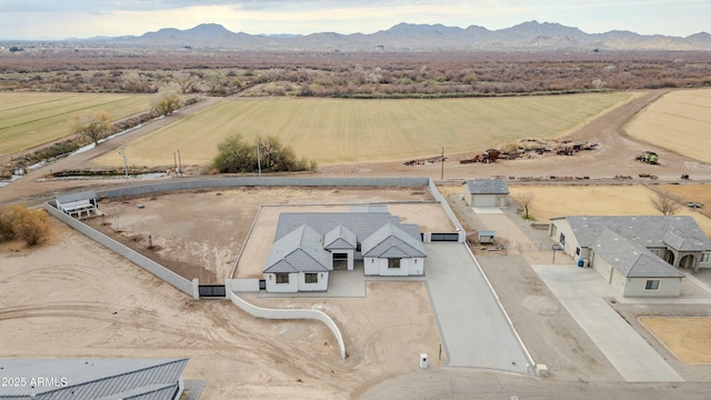 birds eye view of property with a mountain view