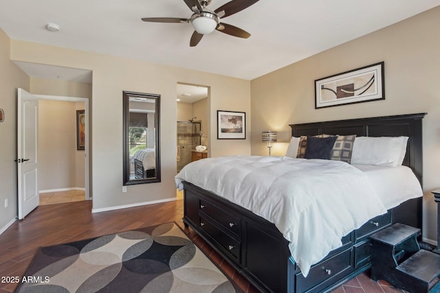 bedroom with dark wood-style flooring, ensuite bathroom, baseboards, and a ceiling fan