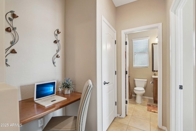 office area with light tile patterned floors