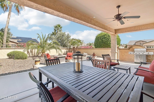 view of patio with a fenced backyard, outdoor dining area, a grill, and a ceiling fan