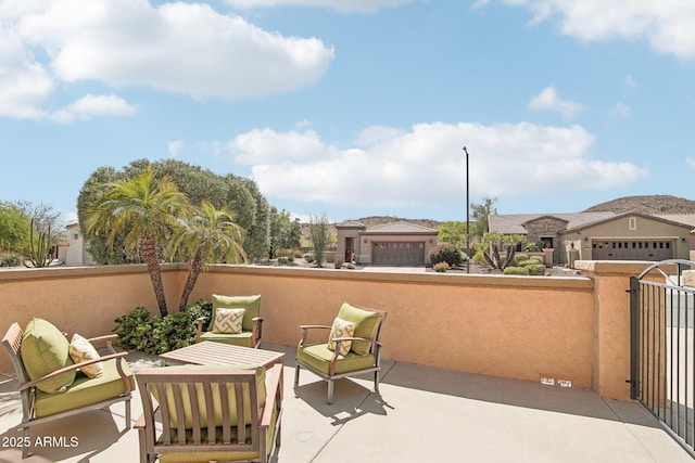 view of patio featuring fence and outdoor lounge area