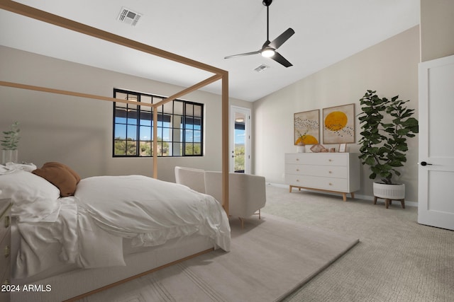 bedroom with ceiling fan, light carpet, and lofted ceiling