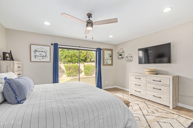 bedroom featuring light hardwood / wood-style flooring, ceiling fan, and access to outside