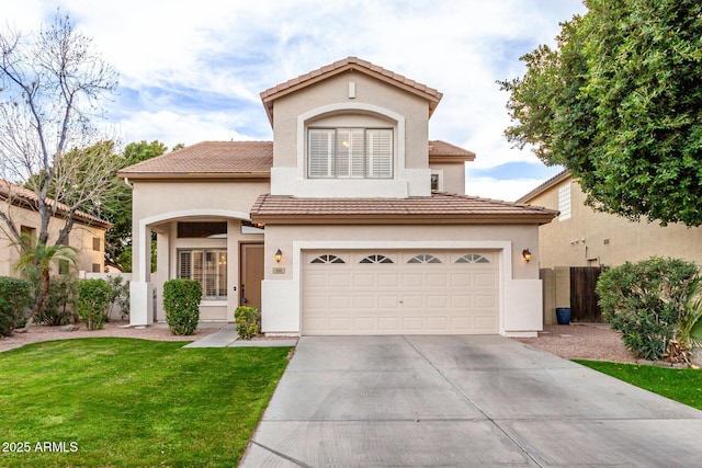 mediterranean / spanish-style house with a garage and a front yard