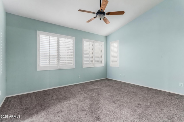 carpeted spare room with vaulted ceiling and ceiling fan