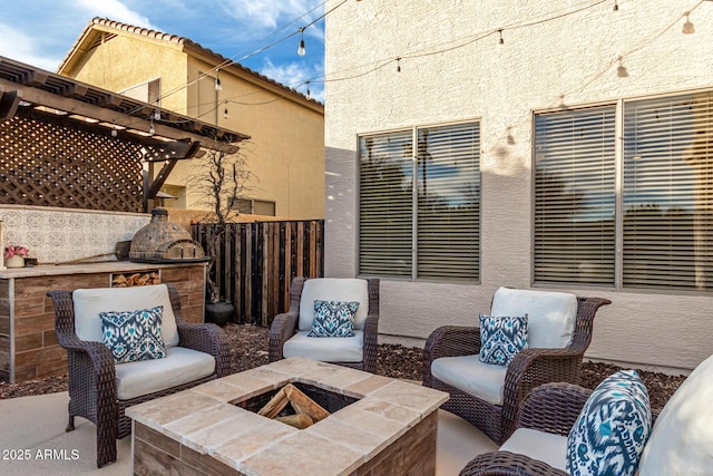 view of patio / terrace with a fire pit