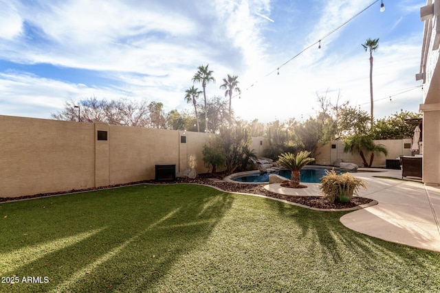 view of yard with a fenced in pool and a patio