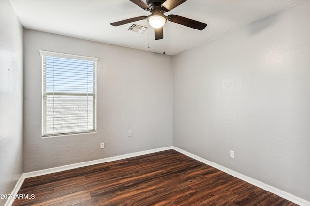 spare room featuring ceiling fan and dark hardwood / wood-style flooring