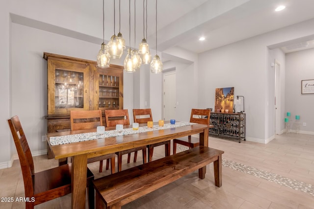 dining space featuring baseboards, visible vents, recessed lighting, and a notable chandelier