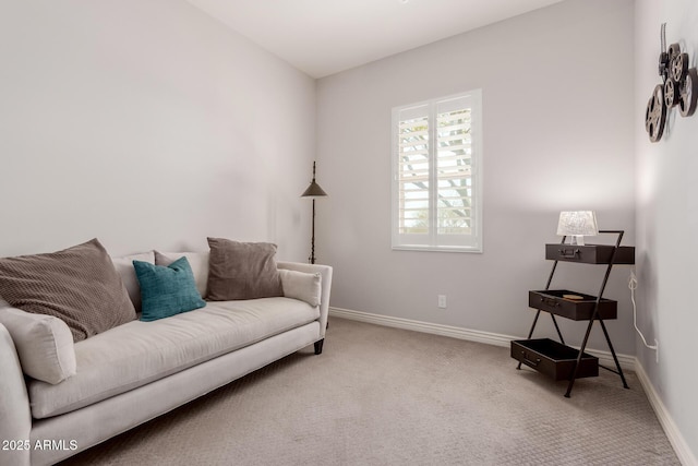 sitting room with carpet flooring and baseboards