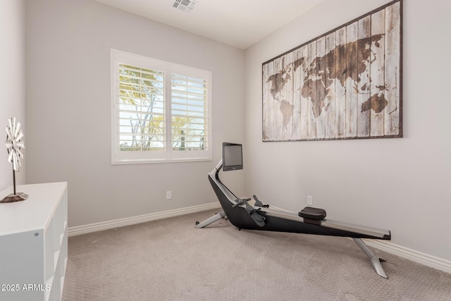workout room featuring carpet floors, baseboards, and visible vents