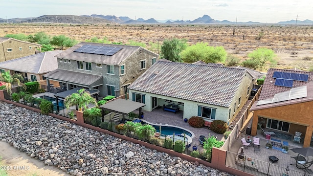 drone / aerial view with a rural view, a mountain view, and a desert view
