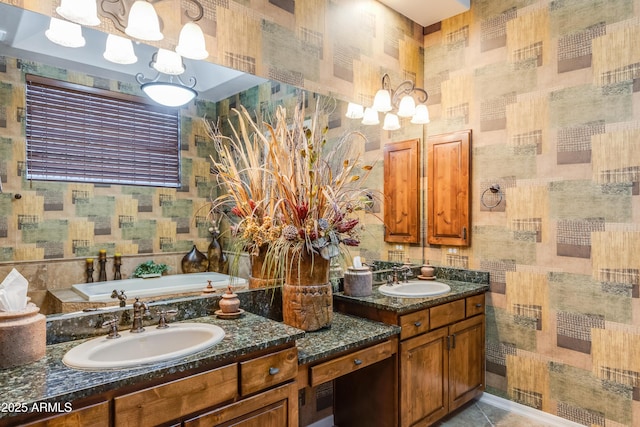 bathroom with tile patterned floors, vanity, and a tub