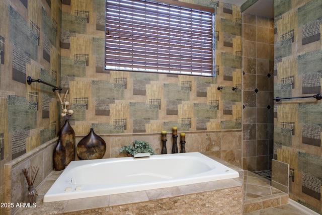 bathroom featuring separate shower and tub