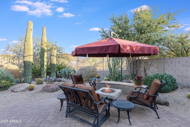 view of patio with a fire pit