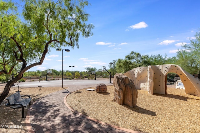 view of community with basketball hoop