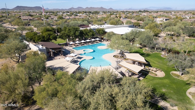 birds eye view of property with a mountain view