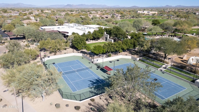 birds eye view of property with a mountain view