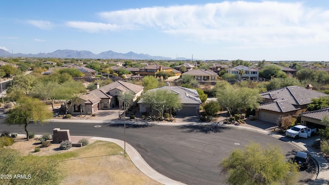 birds eye view of property with a mountain view