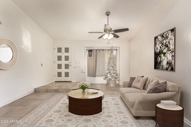 tiled living room with ceiling fan