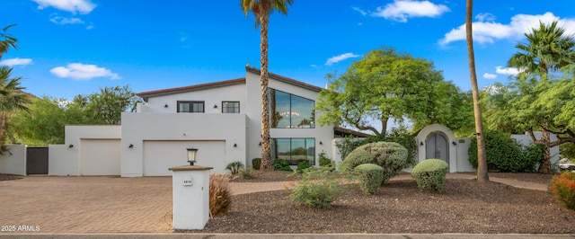 4824 E Hummingbird Ln, Paradise Valley, AZ 85253 - view of front facade featuring decorative driveway, stucco siding, a gate, and a fenced front yard
