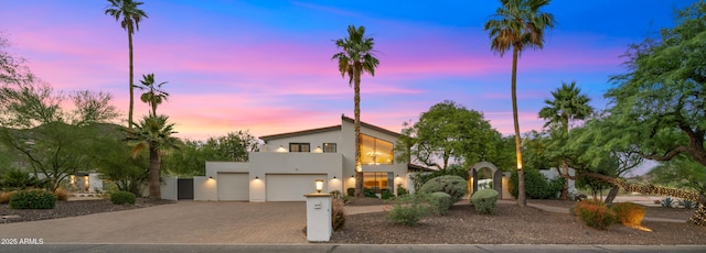 4824 E Hummingbird Ln, Paradise Valley, AZ 85253 - view of front of property with stucco siding, driveway, and a garage