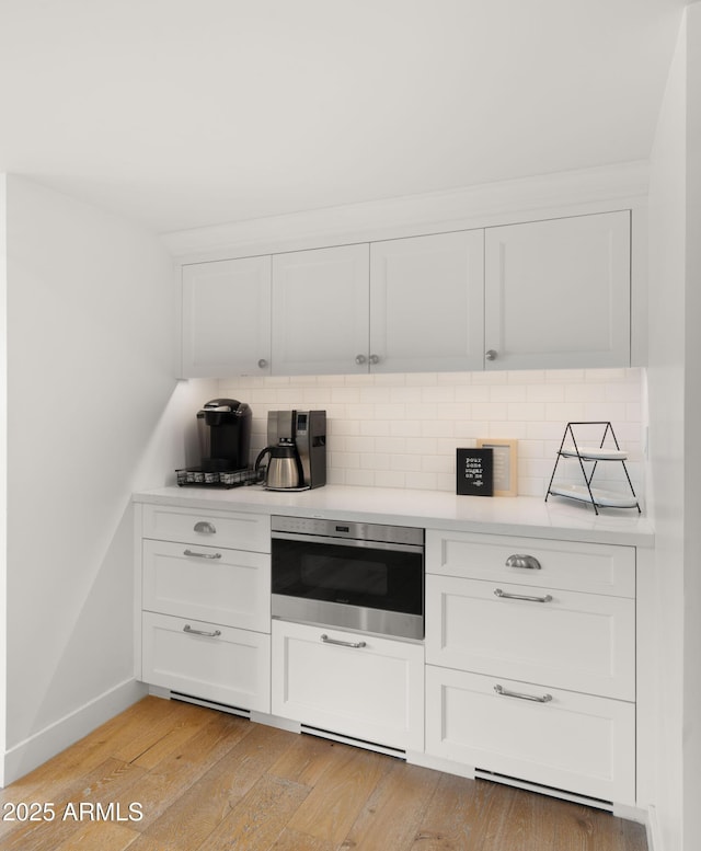 4824 E Hummingbird Ln, Paradise Valley, AZ 85253 - kitchen featuring light countertops and white cabinetry