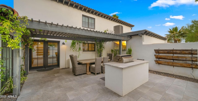 4824 E Hummingbird Ln, Paradise Valley, AZ 85253 - view of patio / terrace with exterior kitchen, a pergola, and outdoor dining space