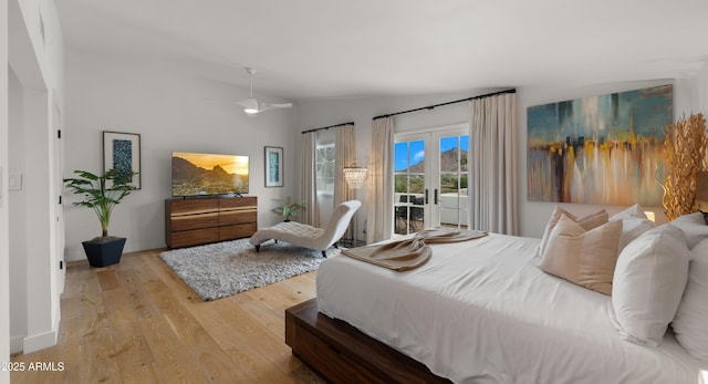 4824 E Hummingbird Ln, Paradise Valley, AZ 85253 - bedroom with access to exterior, vaulted ceiling, and wood finished floors