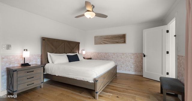 4824 E Hummingbird Ln, Paradise Valley, AZ 85253 - bedroom featuring light wood-style flooring, a wainscoted wall, crown molding, and ceiling fan