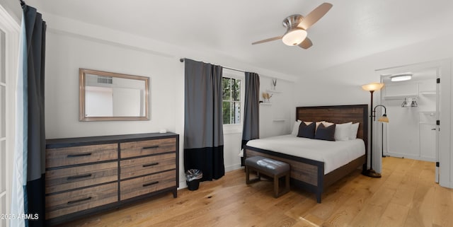 4824 E Hummingbird Ln, Paradise Valley, AZ 85253 - bedroom with light wood finished floors and ceiling fan