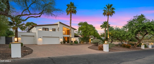 4824 E Hummingbird Ln, Paradise Valley, AZ 85253 - modern home featuring stucco siding, driveway, a balcony, and a garage
