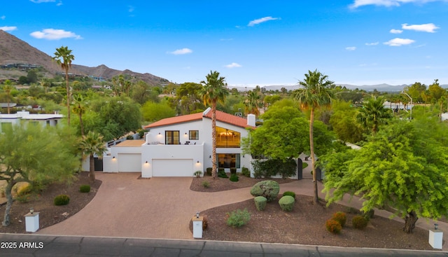 4824 E Hummingbird Ln, Paradise Valley, AZ 85253 - mediterranean / spanish-style home featuring a balcony, a mountain view, driveway, and stucco siding