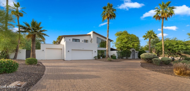 4824 E Hummingbird Ln, Paradise Valley, AZ 85253 - contemporary home with a gate, stucco siding, driveway, a garage, and an attached garage