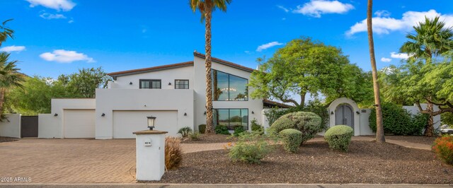 4824 E Hummingbird Ln, Paradise Valley, AZ 85253 - view of front of property with decorative driveway, stucco siding, and a fenced front yard