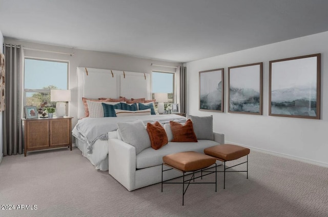 bedroom featuring light colored carpet