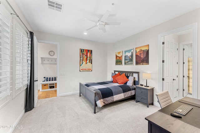 bedroom featuring light carpet and ceiling fan