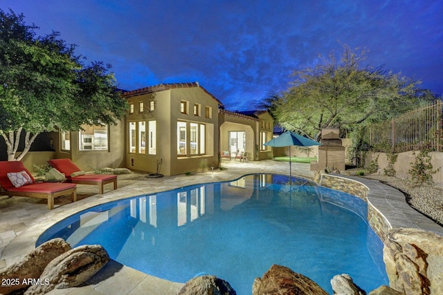 view of swimming pool with a patio area