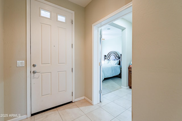 entrance foyer with light tile patterned floors