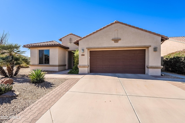 mediterranean / spanish-style house featuring a garage