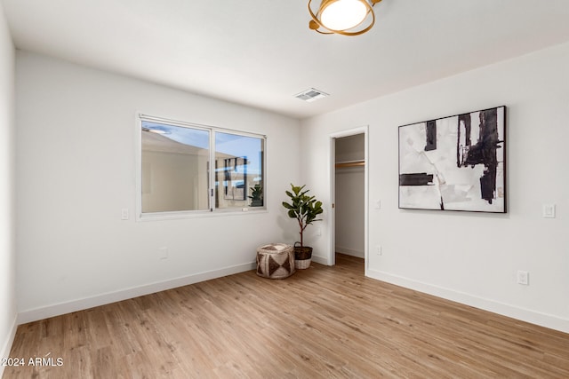 bedroom featuring a closet and light wood-type flooring