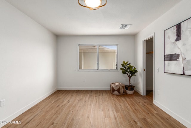 spare room featuring light hardwood / wood-style flooring